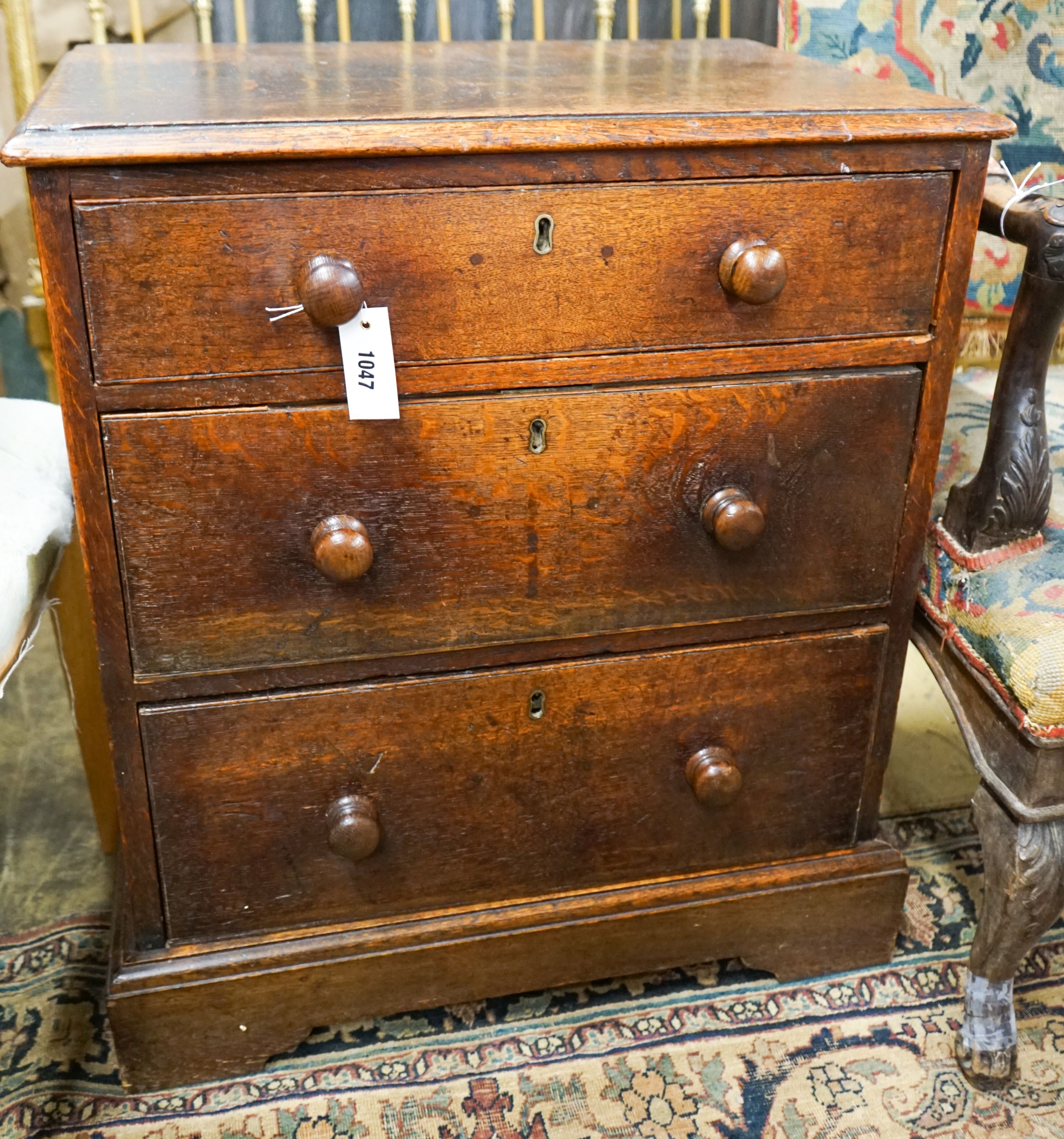 A small Victorian oak three drawer chest, width 61cm, depth 43cm, height 71cm